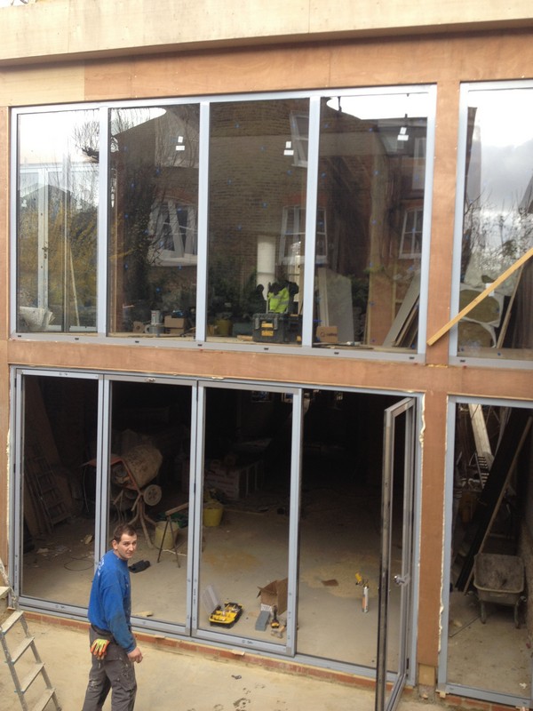 Aluminium bi-fold doors with two-storey glazing in Wolverton