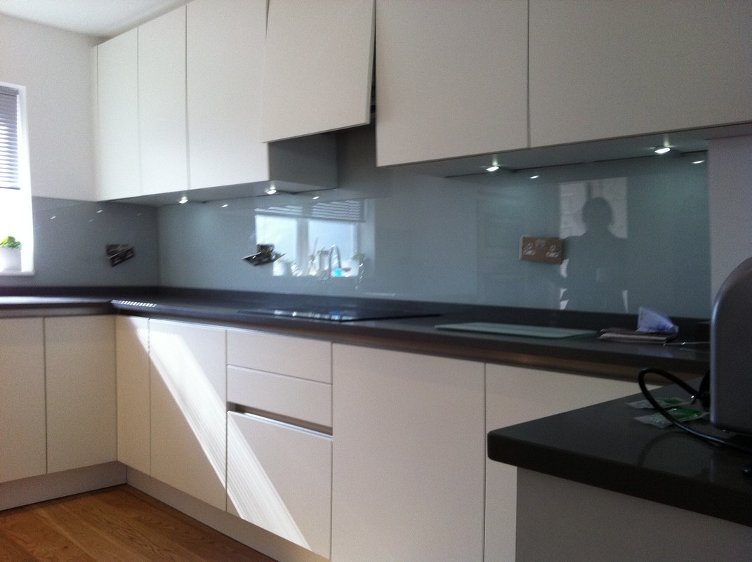 Grey glass kitchen splashback with LED lighting in Wolverton