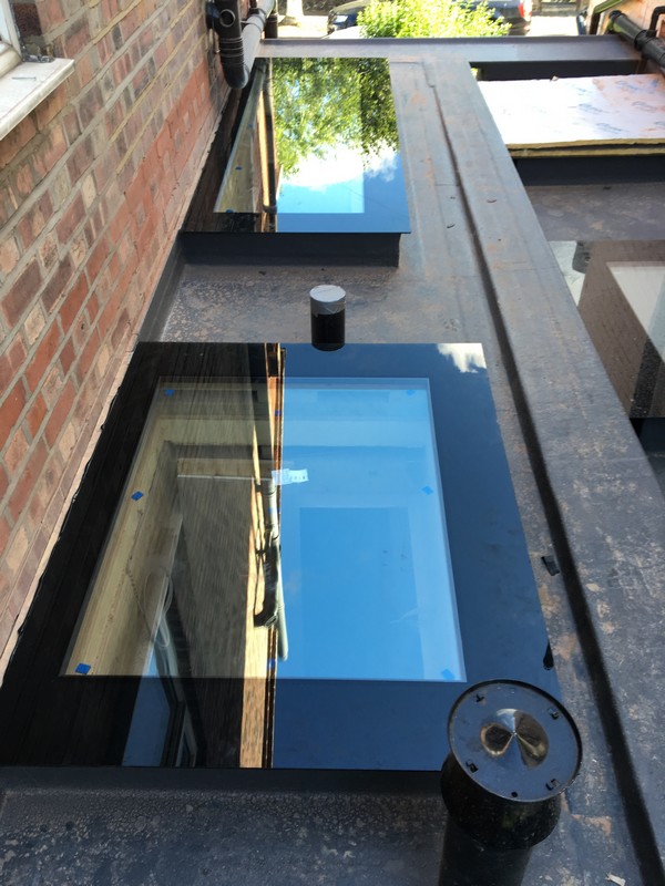 Multiple flat roof skylights on extension in Wolverton