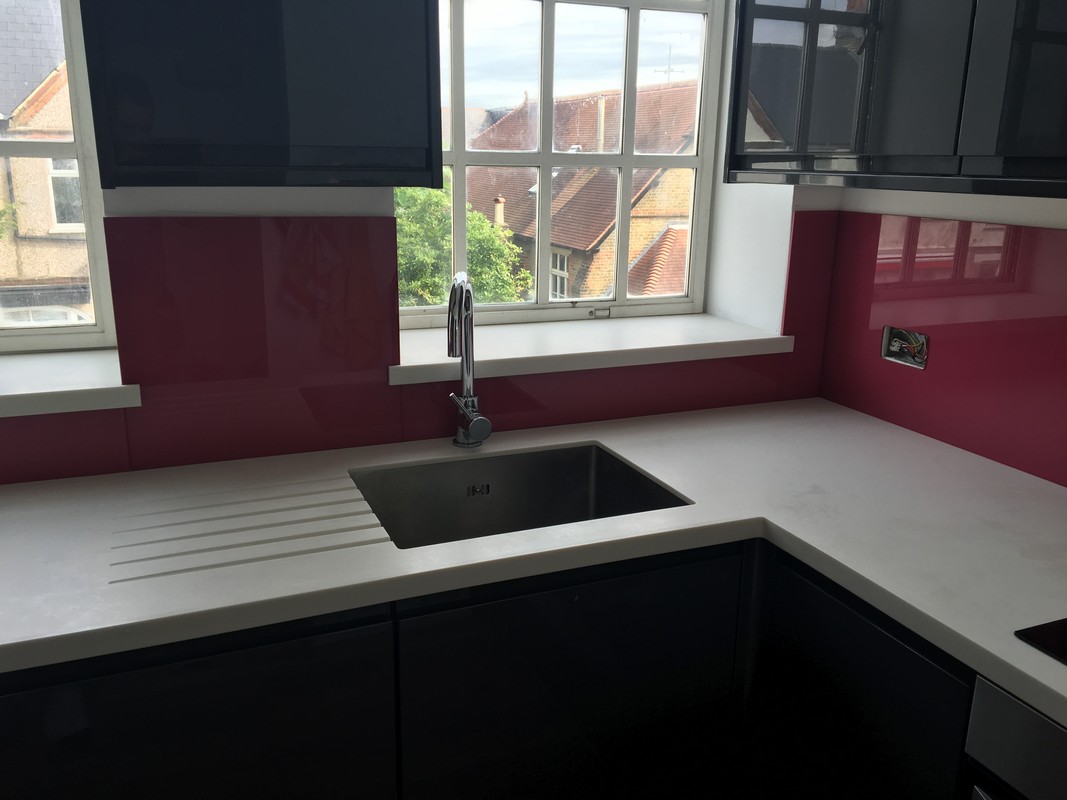 Deep plum coloured glass splashback in modern Wolverton kitchen