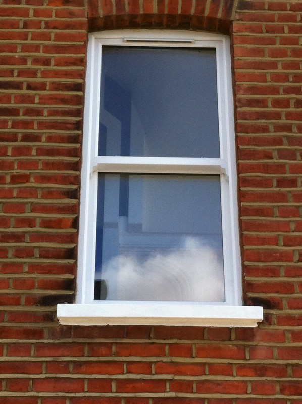 uPVC sash window on Victorian red brick house in Wolverton